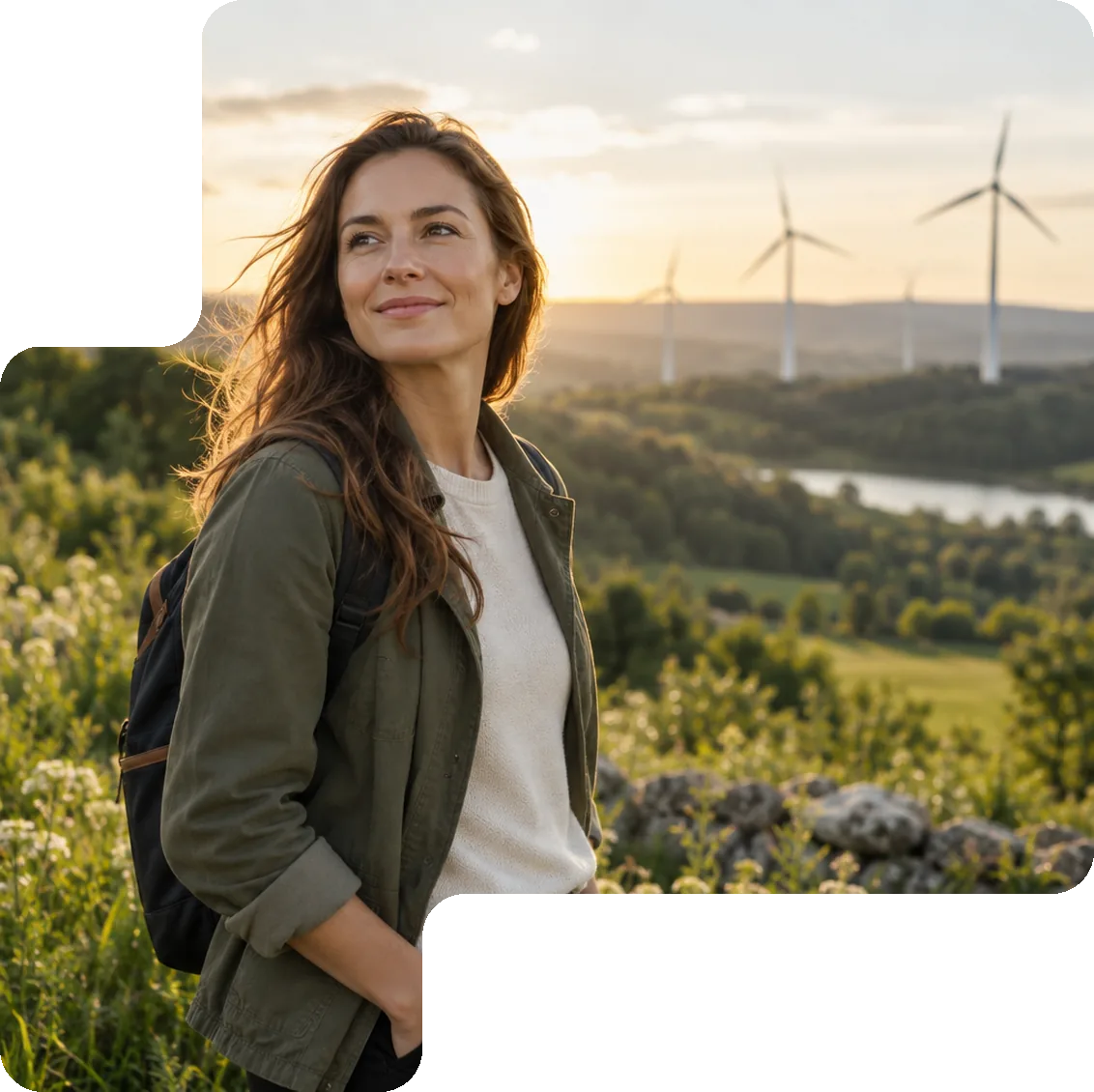 Woman in a sustainable landscape with wind turbines